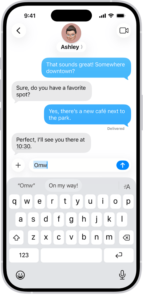 iOS suggesting the text replacement 'On my way!' above the keyboard after the user types 'Omw' in Messages