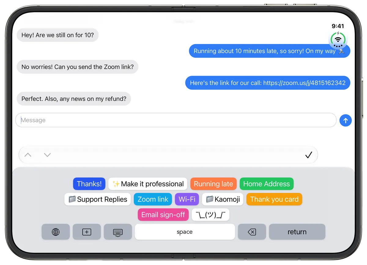 WordBoard keyboard on an unfolded iPhone Duo in landscape, showing keys like Thanks, Make it professional, Running late, Home Address, Zoom link, and Wi-Fi in Messages